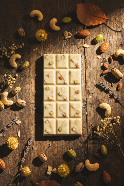 White chocolate bar with nuts in a 3-by-5 segment shape
